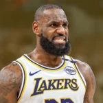 LeBron James in a Lakers uniform with Stephen Curry in the background amid trade rumors