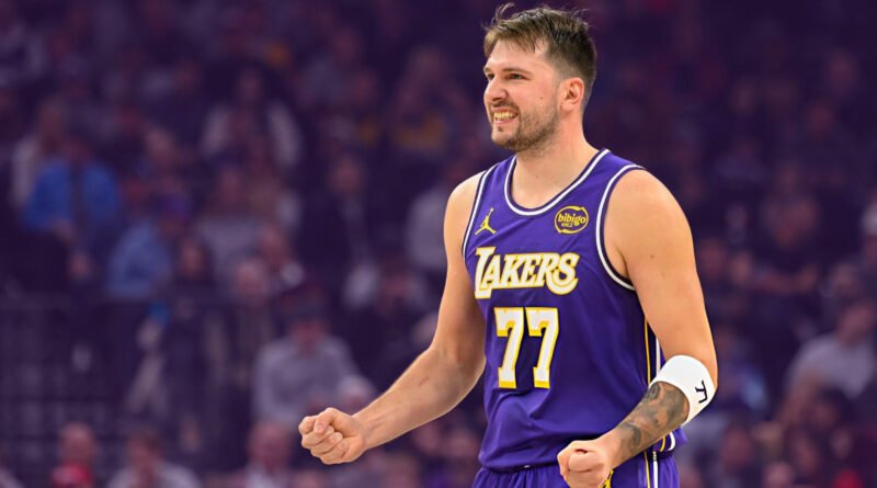 “Los Angeles Lakers star Luka Dončić grimacing after suffering a lower leg injury against the LA Clippers.”
